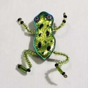 Glass frog pin about two inches